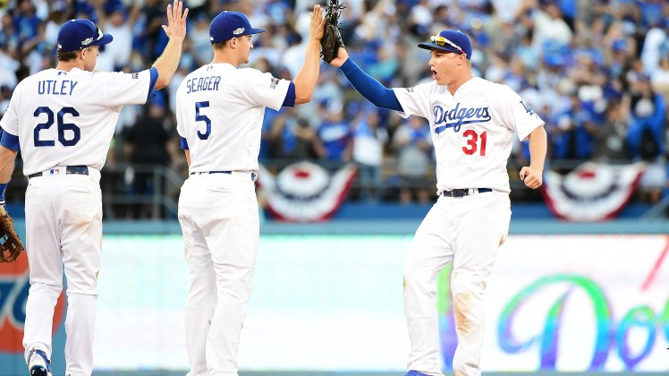 chase-utley-corey-seager-and-joc-pederson-celebrate-dodgers-win_rduabjkta88m1cwkzdihyjj5i